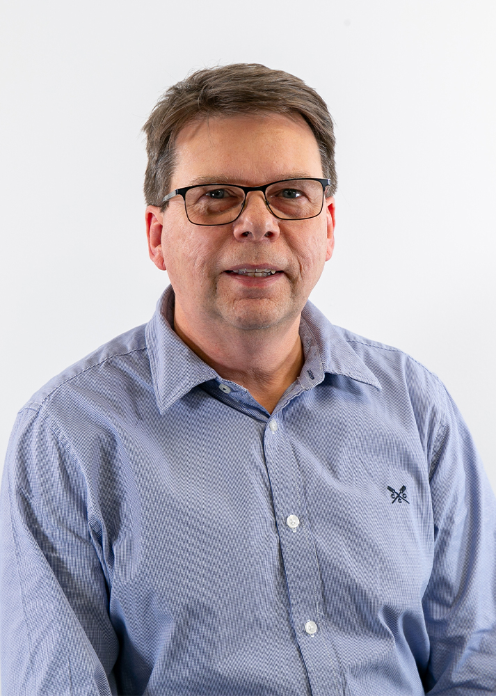 Adrian Searl SLX Operations Director looking towards the camera smiling.