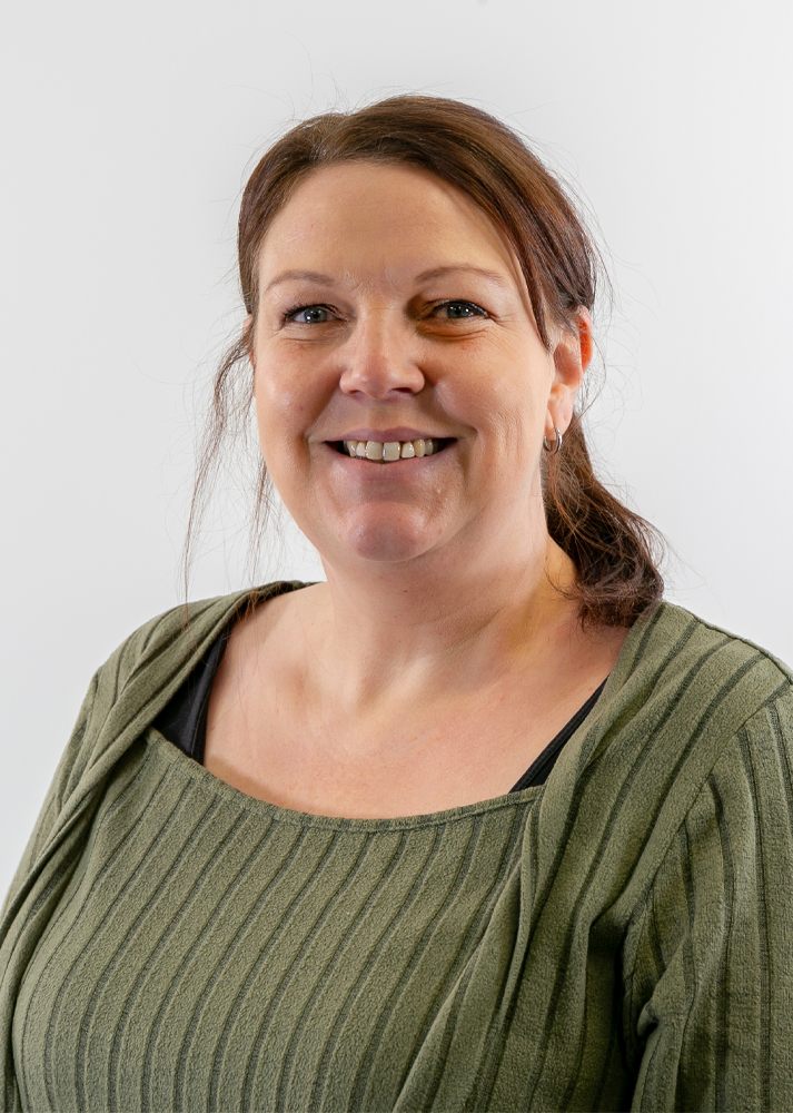 Donna-Jauncey SLX Account Assistant smiling at camera on a white background