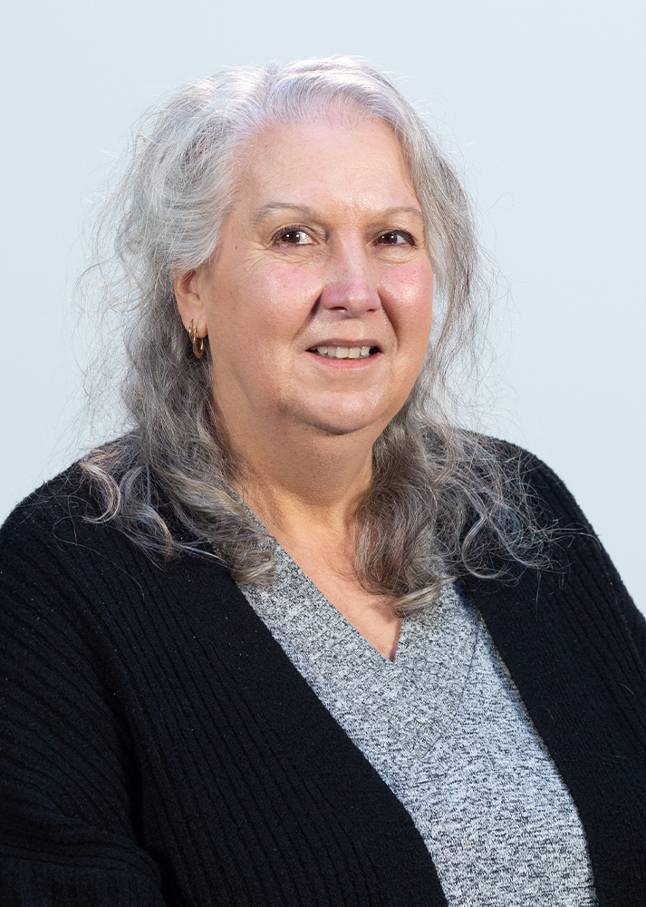 Jacqui Carey SLX Transport Administrator smiling at the camera on a clean white background